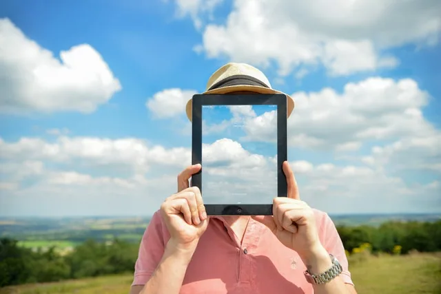 man-person-clouds-apple buying a tablet